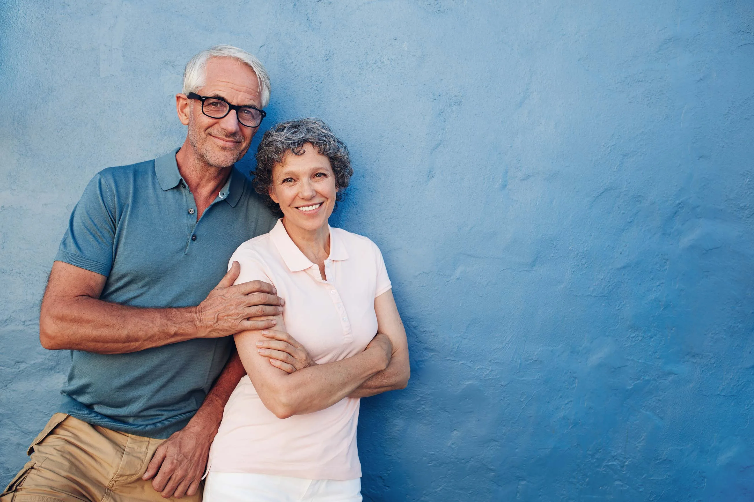 Hornchurch couple smiling after All-on-4 same-day teeth treatment