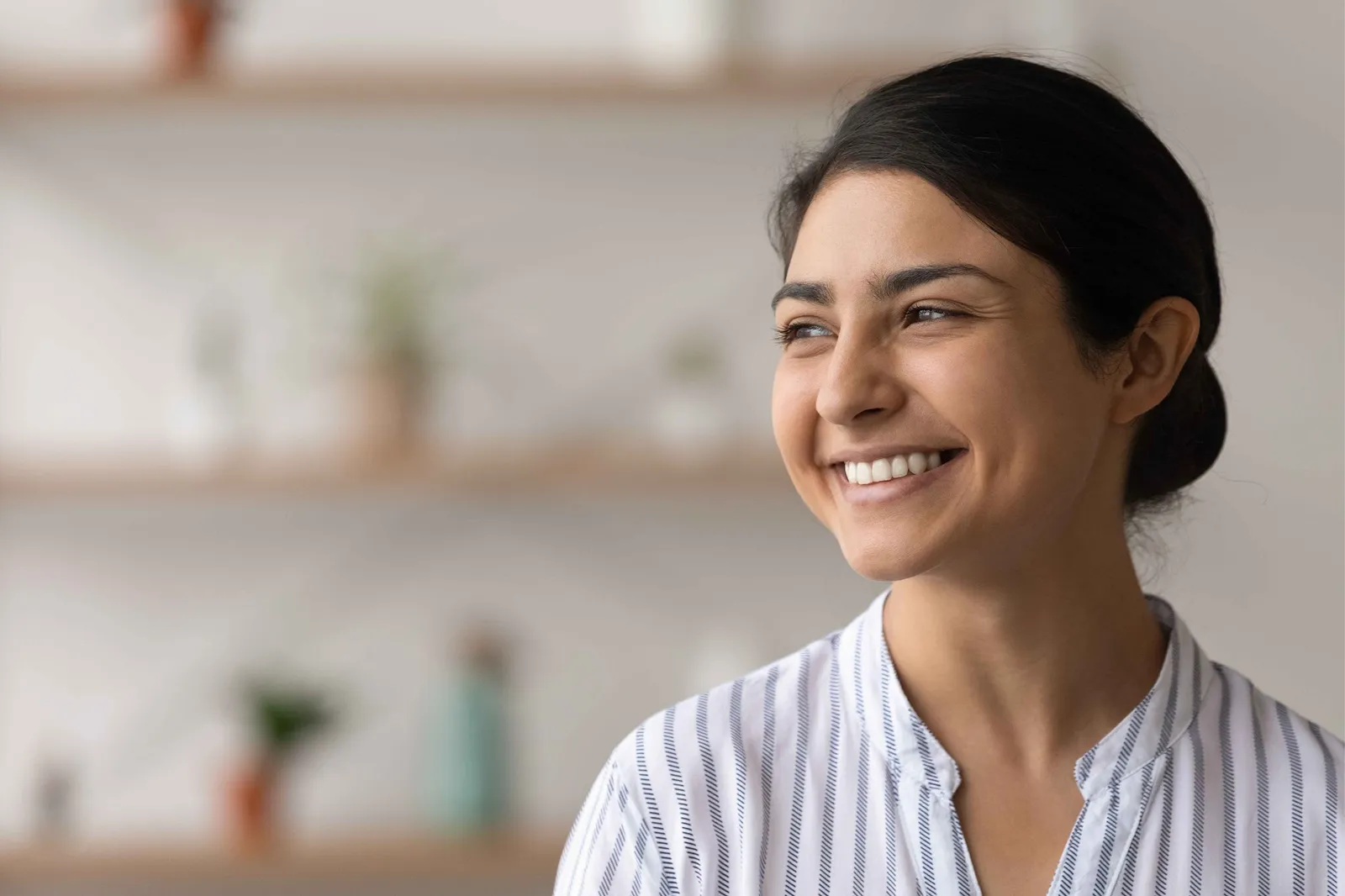 Woman smiling confidently with natural-looking teeth