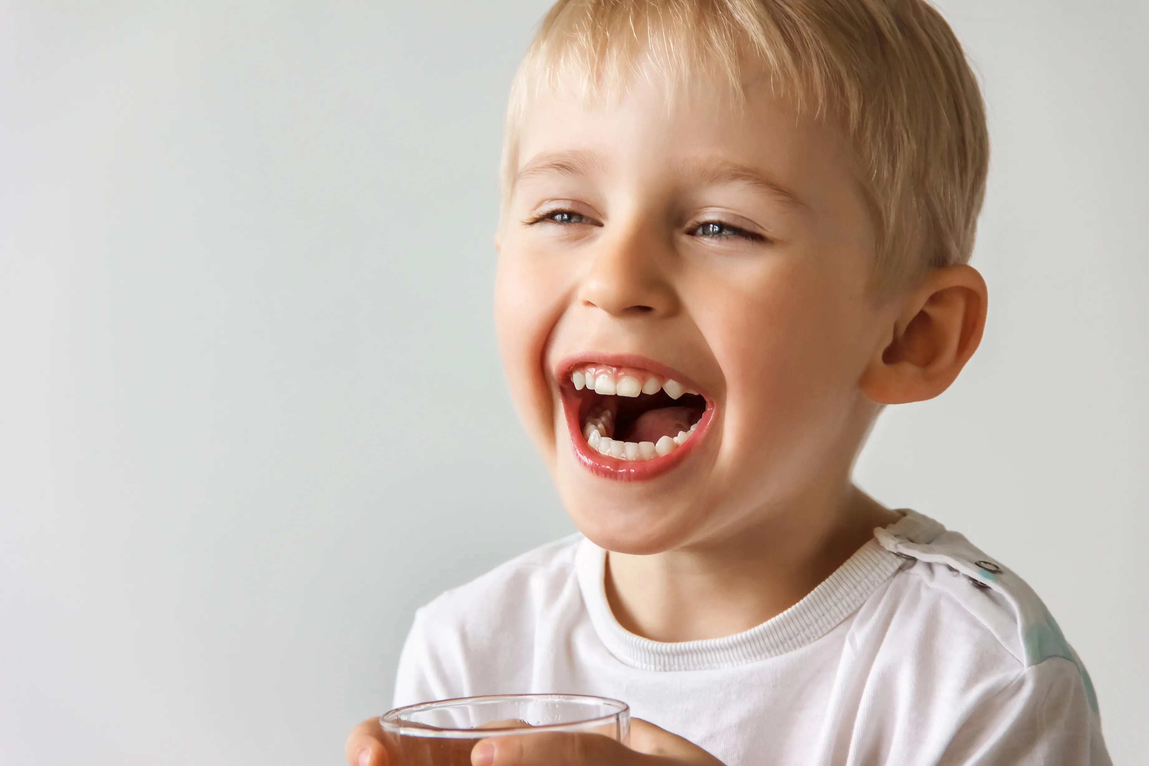 A Hornchurch teenager smiling after children's orthodontic treatment