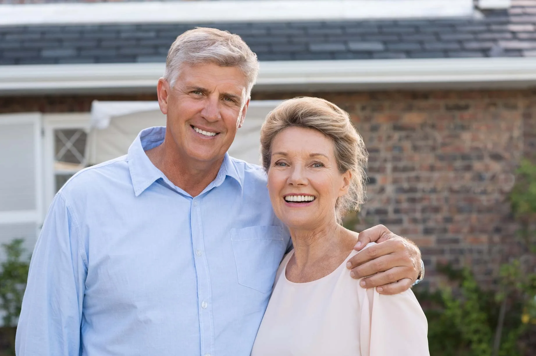 Hornchurch patient smiling with stable implant retained denture