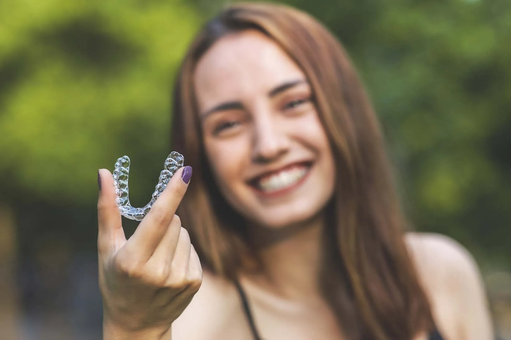 Hornchurch patient smiling after Invisalign treatment